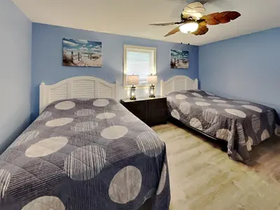 a bedroom with two beds and a ceiling fan at Put-in-Bay Waterfront Condo #104 in Put-in-Bay