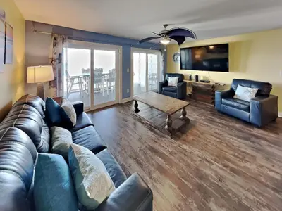 a living room with a couch and a table at Put-in-Bay Waterfront Condo #105 in Put-in-Bay