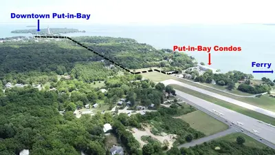 an aerial view of a park with the ocean in the background at Put-in-Bay Waterfront Condo #113 in Put-in-Bay