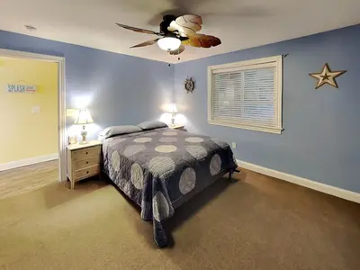 a bedroom with a bed and a ceiling fan at Put-in-Bay Waterfront Condo #113 in Put-in-Bay