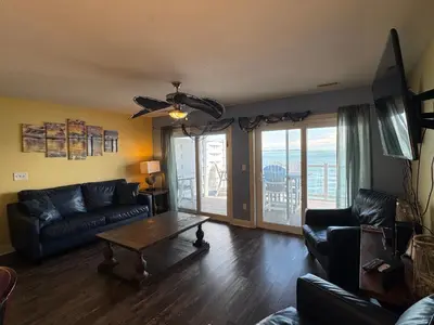 a living room with a couch and a table at Put-in-Bay Waterfront Condo #209 in Put-in-Bay
