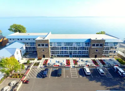 an aerial view of a hotel with a parking lot at Put-in-Bay Waterfront Condo #209 in Put-in-Bay