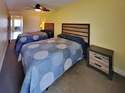 a bedroom with two beds and a ceiling fan at Put-in-Bay Waterfront Condo #208 in Put-in-Bay