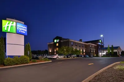 a building with a sign on the side of a road at Holiday Inn Express Hotel & Suites Athens by IHG in Athens