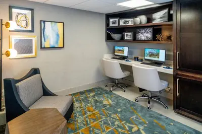 an office with two desks and two computer monitors at Delta Hotels by Marriott Huntington Downtown in Huntington