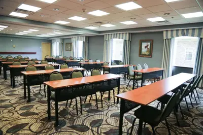a classroom with tables and chairs in a room at Hampton Inn Morehead in Morehead