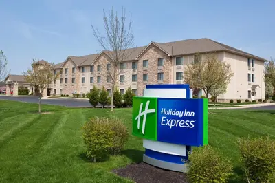a sign in front of a building at Holiday Inn Express Hocking Hills-Logan by IHG in Logan