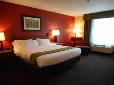 a hotel room with a large bed and a window at Holiday Inn Express Hocking Hills-Logan by IHG in Logan