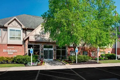 a house with a tree in front of a building at Residence Inn by Marriott Cleveland Independence in Independence