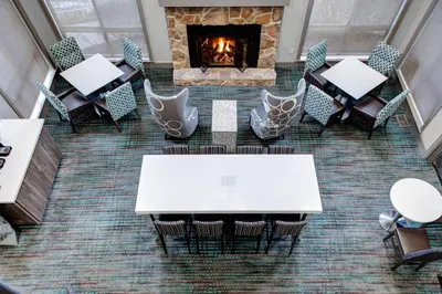 an overhead view of a table and chairs and a fireplace at Residence Inn by Marriott Cleveland Independence in Independence