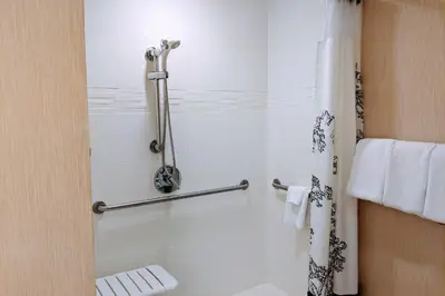 a bathroom with a shower with a toilet at Residence Inn by Marriott Cleveland Beachwood in Beachwood