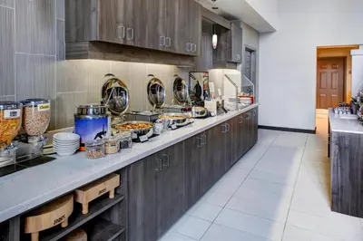a kitchen with a counter with food on it at Residence Inn by Marriott Cleveland Mentor in Mentor