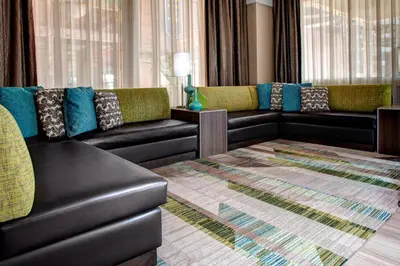 a living room with couches and a rug at Residence Inn by Marriott Cleveland Downtown in Cleveland