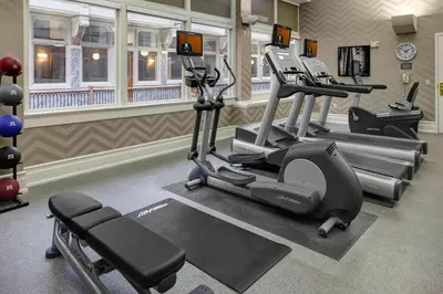 a gym with treadmills and machines in a room at Residence Inn by Marriott Cleveland Downtown in Cleveland