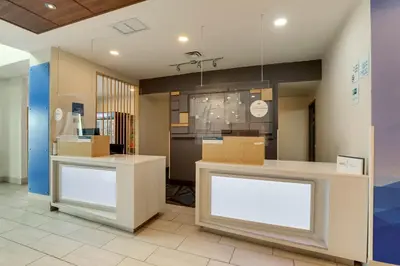 a store with two white counters and boxes at Holiday Inn Express Hotel & Suites Bryan-Montpelier by IHG in Holiday City