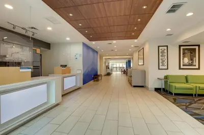 a lobby of a hospital with a waiting room at Holiday Inn Express Hotel & Suites Bryan-Montpelier by IHG in Holiday City