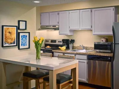 a kitchen with white cabinets and a white counter top at Sonesta Simply Suites Cleveland Westlake in Westlake