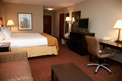 a hotel room with a bed and a desk at Holiday Inn Express Fort Wayne - East - New Haven by IHG in New Haven