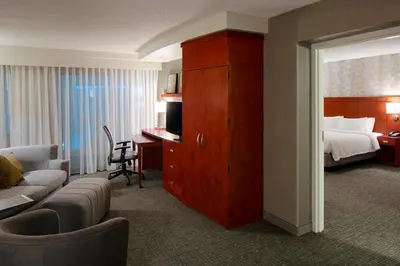 a hotel room with a bed and a desk at Courtyard by Marriott Columbus West/Hilliard in Columbus