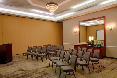 a row of chairs in a room with a podium at Courtyard by Marriott Columbus West/Hilliard in Columbus