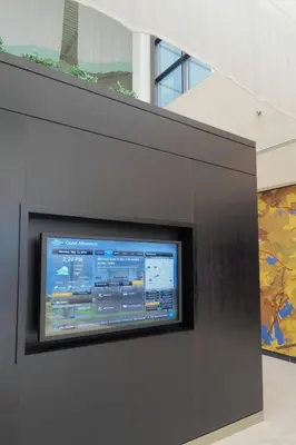 a flat screen tv on a wall in a building at Courtyard by Marriott Columbus West/Hilliard in Columbus