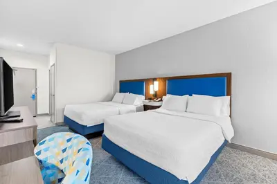 a hotel room with two beds and a tv at Hampton Inn Akron-Fairlawn in Montrose