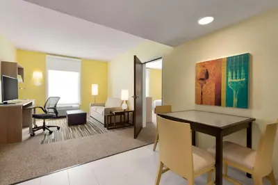 a living room with a table and chairs in a room at Home2 Suites By Hilton-Cleveland Beachwood in Beachwood