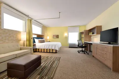 a large hotel room with a bed and a desk at Home2 Suites By Hilton-Cleveland Beachwood in Beachwood