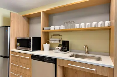 a kitchen with a sink and a microwave at Home2 Suites By Hilton-Cleveland Beachwood in Beachwood