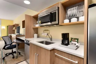 a kitchen with a sink and a microwave at Home2 Suites By Hilton-Cleveland Beachwood in Beachwood