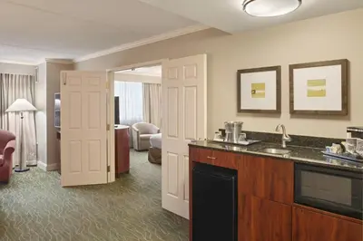 a hotel room with a sink and a bathroom at DoubleTree by Hilton Akron Fairlawn in Fairlawn