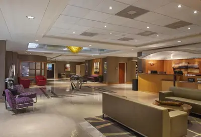 a lobby with couches and chairs in a building at DoubleTree by Hilton Akron Fairlawn in Fairlawn