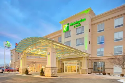 a hotel building with a sign on it at Holiday Inn Hotel & Suites Lima by IHG in Lima