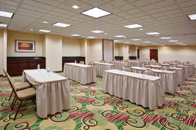 a conference room with tables and chairs in it at Holiday Inn Express Hotel & Suites Cleveland-Streetsboro by IHG in Streetsboro
