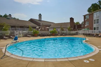 a large pool with blue water in a courtyard at Ohio University Inn and Conference Center in Athens
