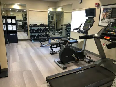 a gym with cardio equipment and a treadmill at Candlewood Suites Fort Wayne - NW by IHG in Fort Wayne