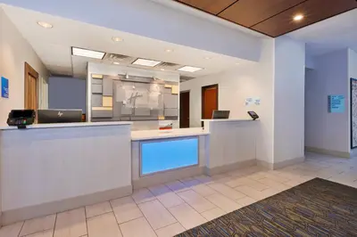 an office with a reception desk and a lobby at Holiday Inn Express Hotel & Suites Cleveland-Richfield by IHG in Brecksville