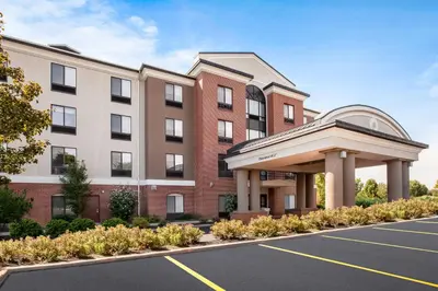 a rendering of a building with a parking lot at Holiday Inn Express Hotel & Suites Cleveland-Richfield by IHG in Brecksville