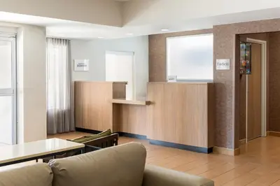 a living room with a couch and a table at Fairfield Inn and Suites by Marriott Cincinnati Eastgate in Eastgate