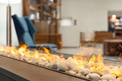 a row of rocks on a table with flames at Doubletree By Hilton Columbus Dublin in Dublin