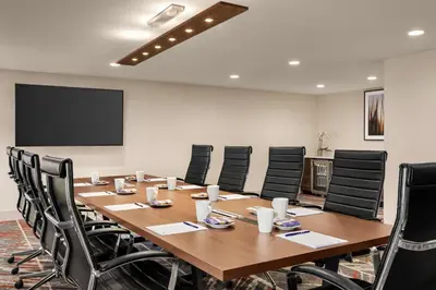 a conference room with a large wooden table and chairs at Doubletree By Hilton Columbus Dublin in Dublin