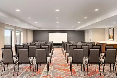 a conference room with chairs and a projection screen at Doubletree By Hilton Columbus Dublin in Dublin