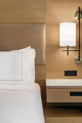 a bedroom with a bed and a lamp on a nightstand at Doubletree By Hilton Columbus Dublin in Dublin