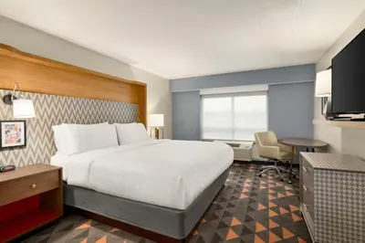 a hotel room with a bed and a desk at Holiday Inn Florence by IHG in Florence