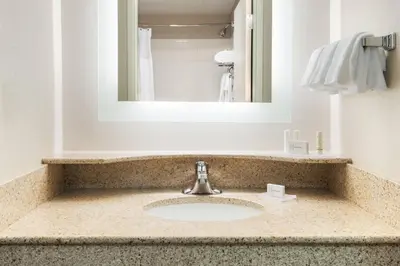 a bathroom with a sink and a mirror at SpringHill Suites by Marriott Cleveland Solon in Solon