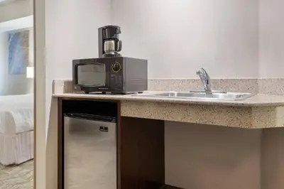 a microwave sitting on a counter next to a sink at SpringHill Suites by Marriott Cleveland Solon in Solon