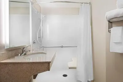 a bathroom with a sink and a shower at SpringHill Suites by Marriott Cleveland Solon in Solon