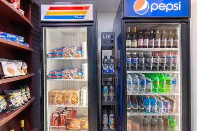 an open refrigerator filled with lots of drinks at SpringHill Suites by Marriott Cleveland Solon in Solon