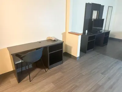 a desk with a television and a chair in a room at Motel 6-Anderson, IN in Anderson