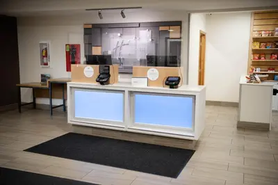 a store with a counter with boxes on it at Holiday Inn Express Winfield - Teays Valley by IHG in Hurricane